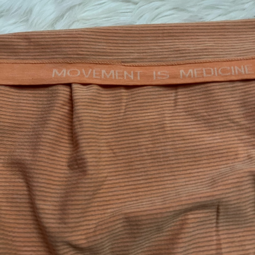 Lululemon orange shirt. Size 8-10. Motivational on the inside of the sleeves. - Picture 4 of 4